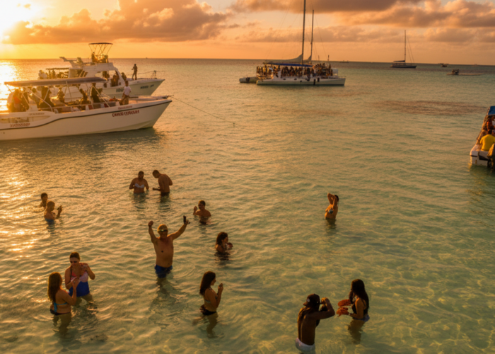 Tourists enjoying a sunset excursion in Punta Cana's clear waters.