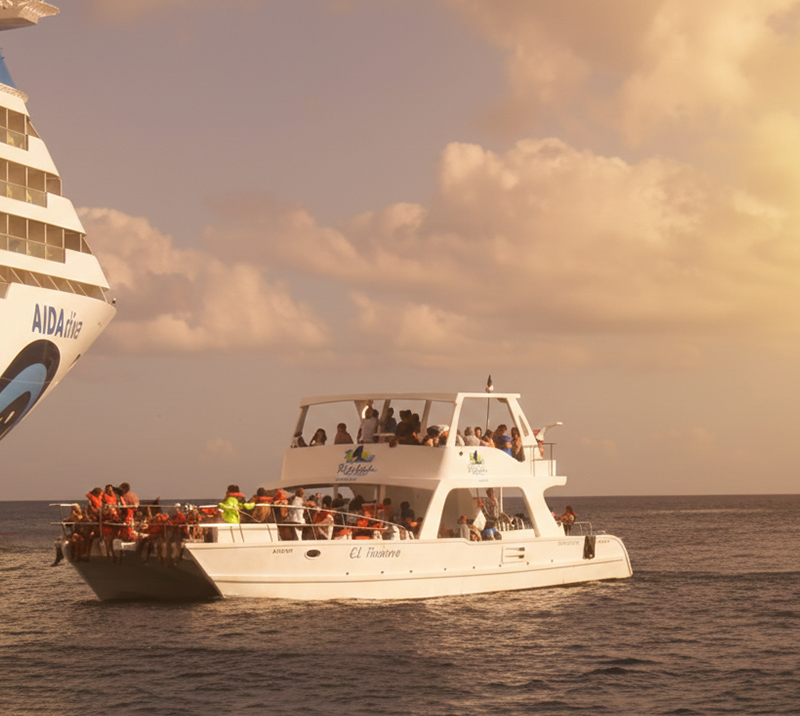 Excursia Punta Cana boat near a cruise ship at sunset