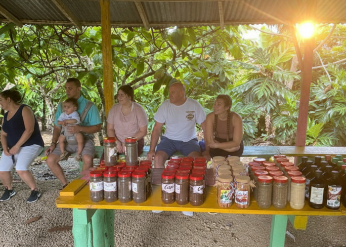 Visitors enjoying local products at Excursia Punta Cana tour site.