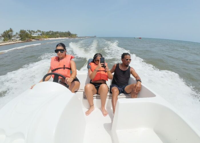 Group enjoying a boat ride in Punta Cana with life jackets