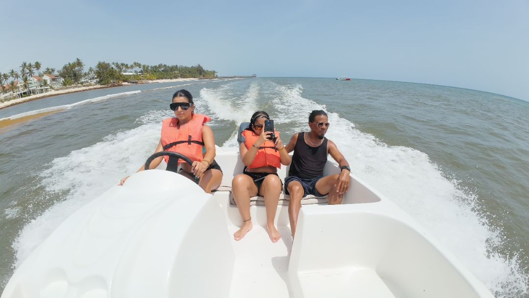 Group enjoying a boat ride in Punta Cana with life jackets